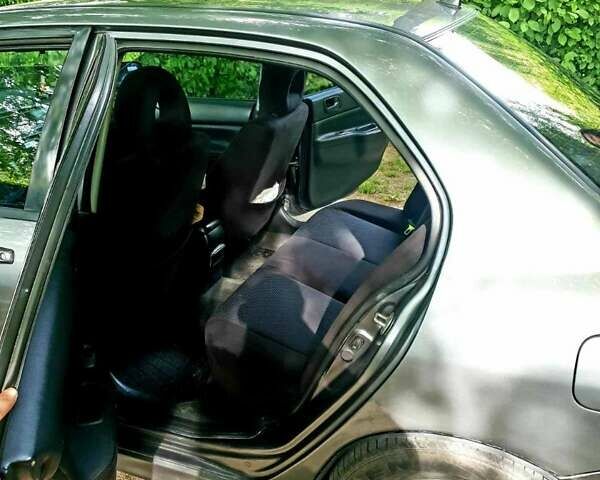 Сірий Міцубісі Lancer, об'ємом двигуна 1.58 л та пробігом 220 тис. км за 4500 $, фото 7 на Automoto.ua