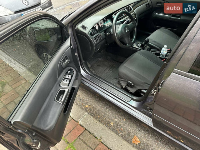 Серый Мицубиси Лансер, объемом двигателя 1.6 л и пробегом 115 тыс. км за 2800 $, фото 11 на Automoto.ua