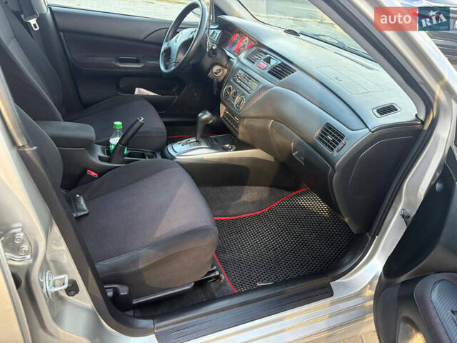 Серый Мицубиси Лансер, объемом двигателя 2 л и пробегом 184 тыс. км за 4900 $, фото 8 на Automoto.ua