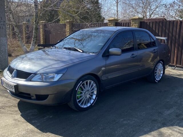 Серый Мицубиси Лансер, объемом двигателя 1.6 л и пробегом 250 тыс. км за 3999 $, фото 22 на Automoto.ua