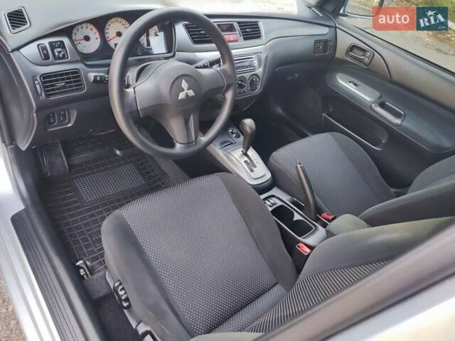 Сірий Міцубісі Lancer, об'ємом двигуна 1.58 л та пробігом 122 тис. км за 6300 $, фото 36 на Automoto.ua