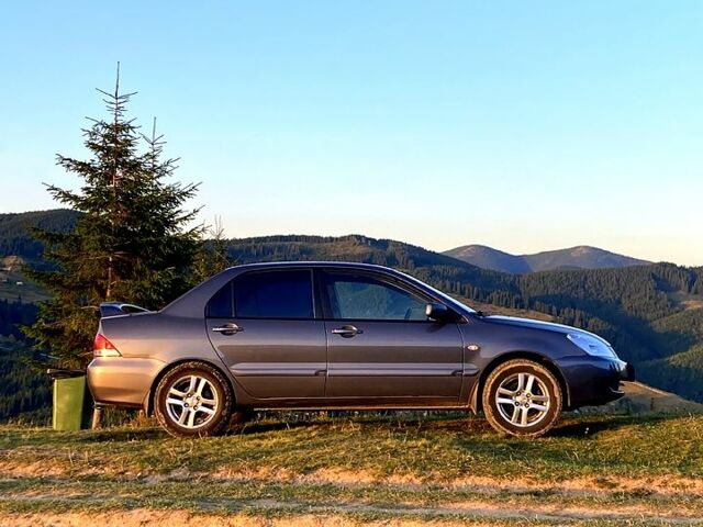 Сірий Міцубісі Lancer, об'ємом двигуна 1.6 л та пробігом 240 тис. км за 4450 $, фото 1 на Automoto.ua