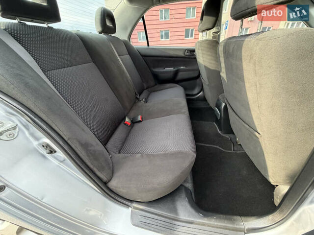 Серый Мицубиси Лансер, объемом двигателя 1.3 л и пробегом 160 тыс. км за 5555 $, фото 63 на Automoto.ua