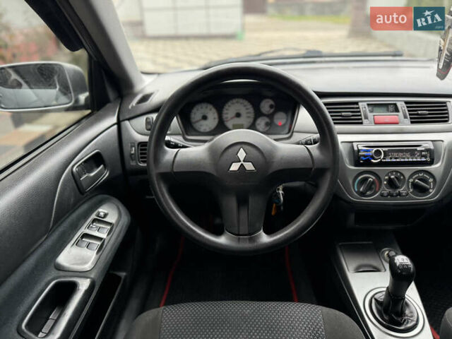 Сірий Міцубісі Lancer, об'ємом двигуна 1.6 л та пробігом 281 тис. км за 3999 $, фото 21 на Automoto.ua