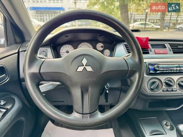 Сірий Міцубісі Lancer, об'ємом двигуна 1.58 л та пробігом 138 тис. км за 4990 $, фото 22 на Automoto.ua