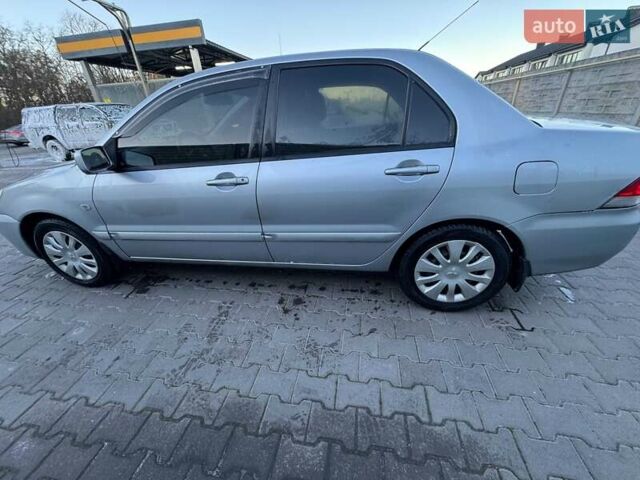 Серый Мицубиси Лансер, объемом двигателя 1.6 л и пробегом 256 тыс. км за 4500 $, фото 2 на Automoto.ua