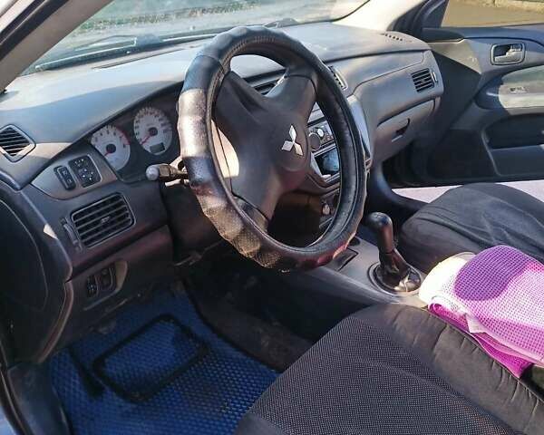 Серый Мицубиси Лансер, объемом двигателя 1.58 л и пробегом 300 тыс. км за 4400 $, фото 8 на Automoto.ua