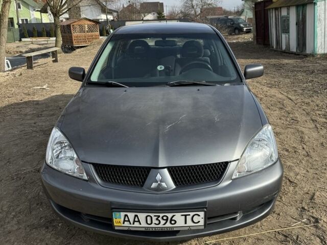Серый Мицубиси Лансер, объемом двигателя 1.6 л и пробегом 129 тыс. км за 5000 $, фото 4 на Automoto.ua