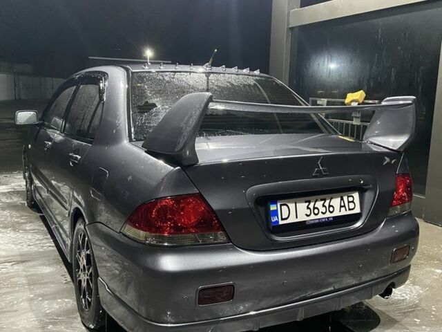 Серый Мицубиси Лансер, объемом двигателя 1.6 л и пробегом 280 тыс. км за 4000 $, фото 2 на Automoto.ua