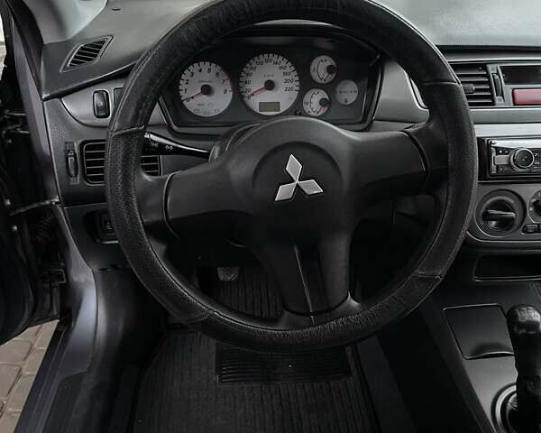 Сірий Міцубісі Lancer, об'ємом двигуна 1.6 л та пробігом 330 тис. км за 3500 $, фото 12 на Automoto.ua