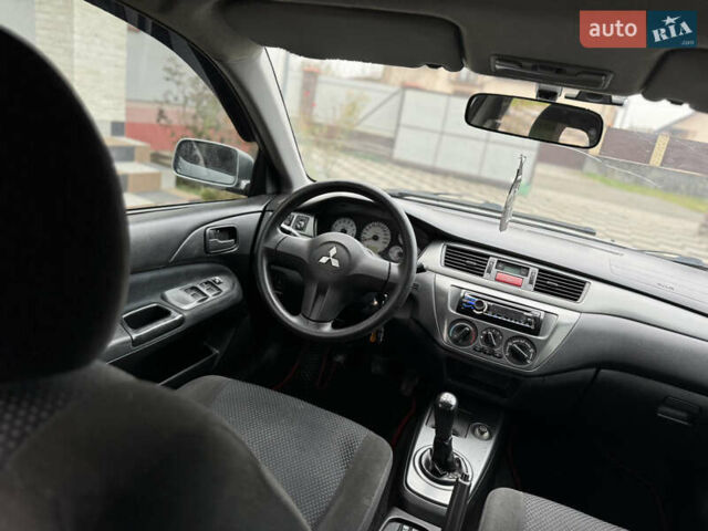 Сірий Міцубісі Lancer, об'ємом двигуна 1.6 л та пробігом 281 тис. км за 3999 $, фото 19 на Automoto.ua