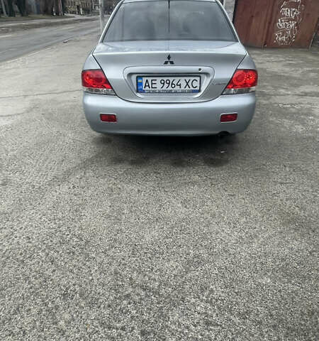 Серый Мицубиси Лансер, объемом двигателя 2 л и пробегом 230 тыс. км за 4000 $, фото 2 на Automoto.ua