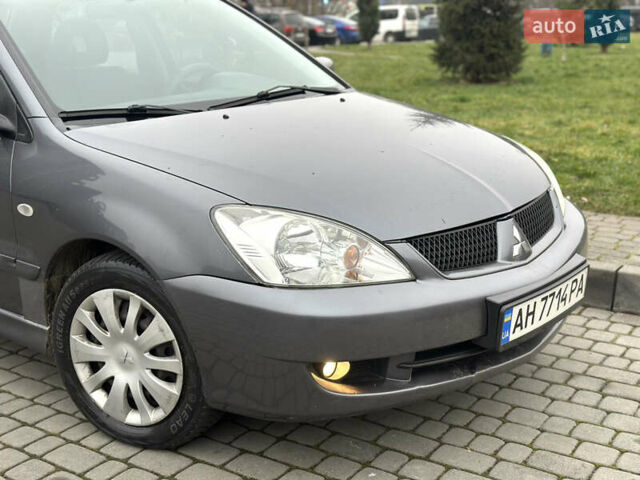 Сірий Міцубісі Lancer, об'ємом двигуна 1.6 л та пробігом 177 тис. км за 2800 $, фото 14 на Automoto.ua