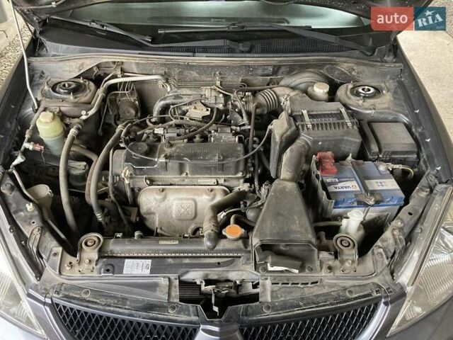 Сірий Міцубісі Lancer, об'ємом двигуна 1.59 л та пробігом 44 тис. км за 6200 $, фото 15 на Automoto.ua