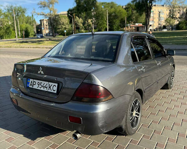 Сірий Міцубісі Lancer, об'ємом двигуна 1.58 л та пробігом 208 тис. км за 5300 $, фото 4 на Automoto.ua