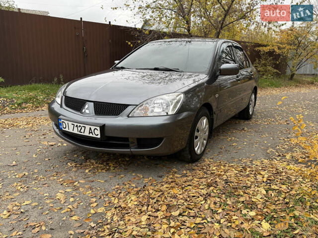 Сірий Міцубісі Lancer, об'ємом двигуна 1.58 л та пробігом 247 тис. км за 4900 $, фото 15 на Automoto.ua