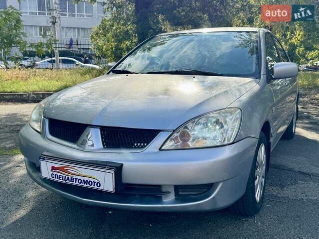 Сірий Міцубісі Lancer, об'ємом двигуна 1.58 л та пробігом 138 тис. км за 4990 $, фото 5 на Automoto.ua
