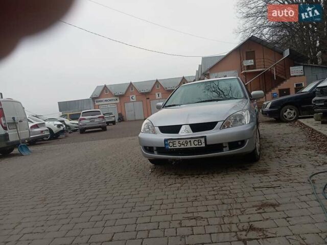 Серый Мицубиси Лансер, объемом двигателя 1.6 л и пробегом 175 тыс. км за 4200 $, фото 13 на Automoto.ua