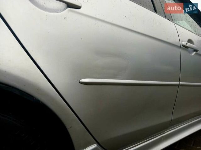 Сірий Міцубісі Lancer, об'ємом двигуна 2 л та пробігом 268 тис. км за 5555 $, фото 1 на Automoto.ua