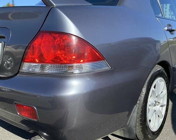 Сірий Міцубісі Lancer, об'ємом двигуна 1.6 л та пробігом 293 тис. км за 5000 $, фото 5 на Automoto.ua