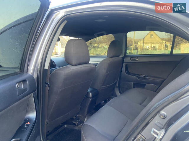 Серый Мицубиси Лансер, объемом двигателя 1.5 л и пробегом 224 тыс. км за 6300 $, фото 9 на Automoto.ua