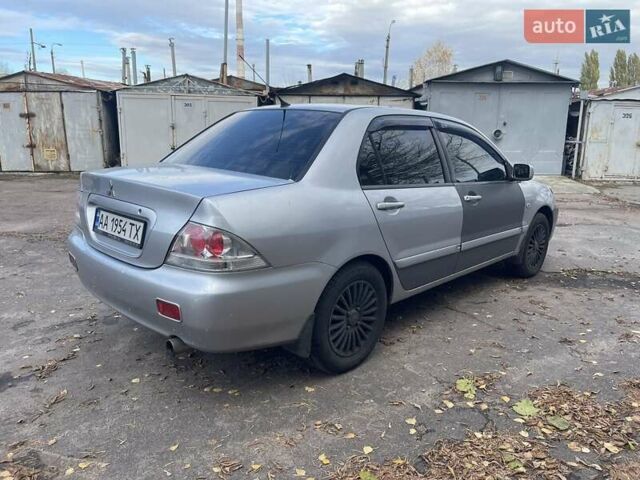 Сірий Міцубісі Lancer, об'ємом двигуна 1.58 л та пробігом 305 тис. км за 3300 $, фото 4 на Automoto.ua