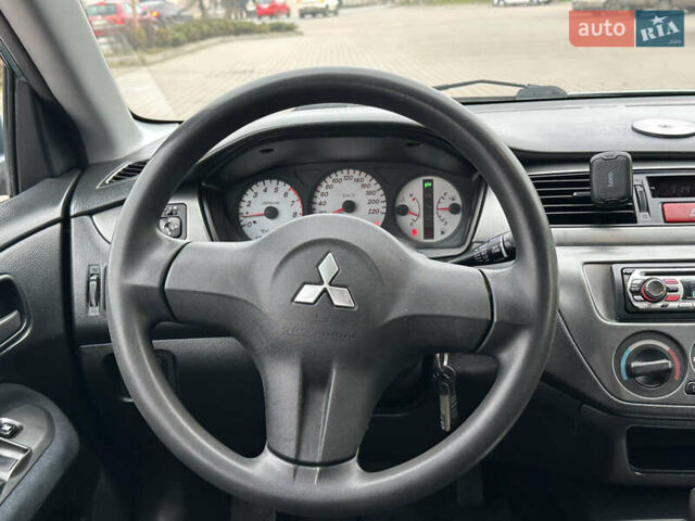 Сірий Міцубісі Lancer, об'ємом двигуна 1.6 л та пробігом 116 тис. км за 5199 $, фото 24 на Automoto.ua