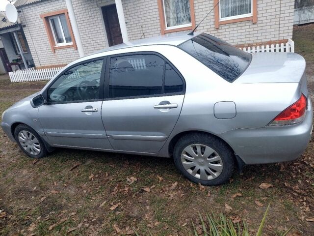 Серый Мицубиси Лансер, объемом двигателя 1.6 л и пробегом 220 тыс. км за 4000 $, фото 2 на Automoto.ua