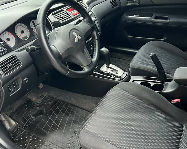 Сірий Міцубісі Lancer, об'ємом двигуна 1.58 л та пробігом 176 тис. км за 4700 $, фото 9 на Automoto.ua
