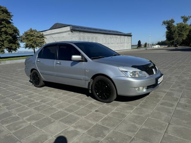 Серый Мицубиси Лансер, объемом двигателя 1.6 л и пробегом 265 тыс. км за 4100 $, фото 1 на Automoto.ua