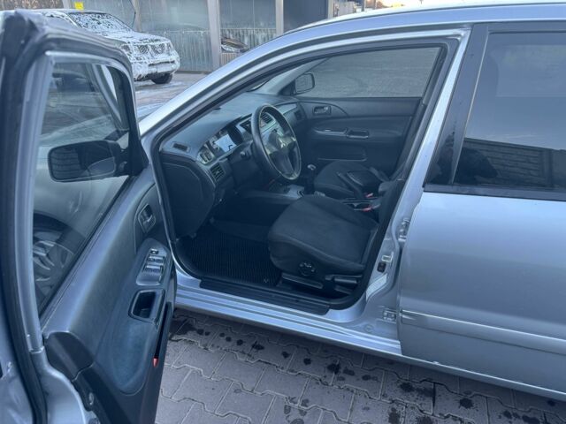 Серый Мицубиси Лансер, объемом двигателя 1.6 л и пробегом 256 тыс. км за 4500 $, фото 4 на Automoto.ua