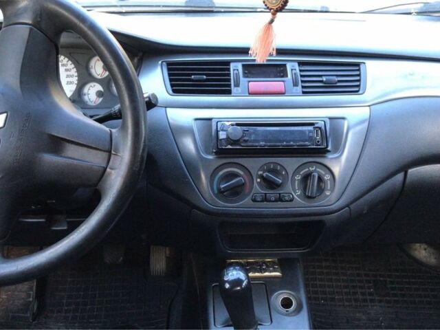 Серый Мицубиси Лансер, объемом двигателя 1.5 л и пробегом 269 тыс. км за 4200 $, фото 23 на Automoto.ua