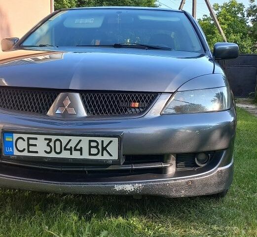 Сірий Міцубісі Lancer, об'ємом двигуна 2 л та пробігом 160 тис. км за 4900 $, фото 4 на Automoto.ua