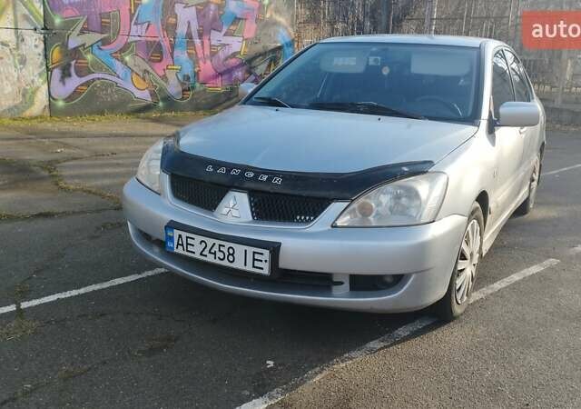 Серый Мицубиси Лансер, объемом двигателя 1.6 л и пробегом 205 тыс. км за 4500 $, фото 4 на Automoto.ua