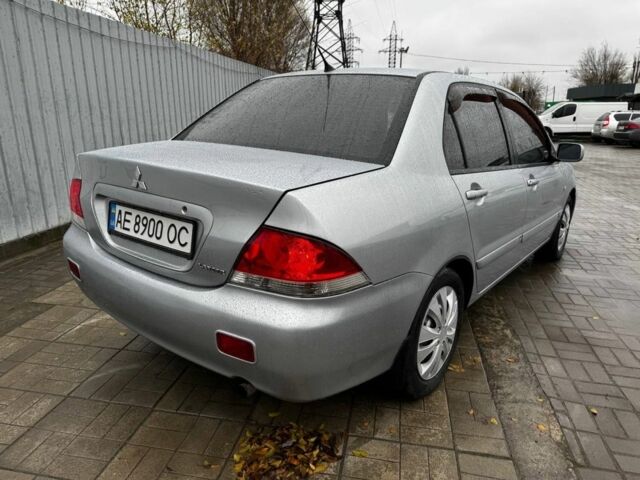 Серый Мицубиси Лансер, объемом двигателя 1.6 л и пробегом 205 тыс. км за 5300 $, фото 2 на Automoto.ua