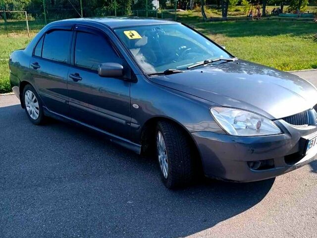 Сірий Міцубісі Lancer, об'ємом двигуна 1.6 л та пробігом 300 тис. км за 4400 $, фото 1 на Automoto.ua