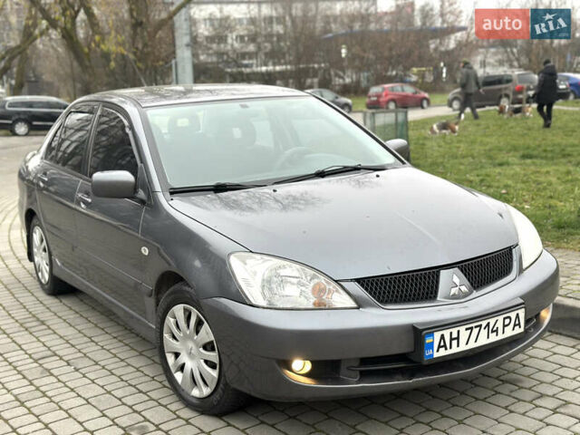 Сірий Міцубісі Lancer, об'ємом двигуна 1.6 л та пробігом 177 тис. км за 2800 $, фото 11 на Automoto.ua
