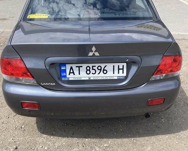 Сірий Міцубісі Lancer, об'ємом двигуна 1.59 л та пробігом 44 тис. км за 6200 $, фото 5 на Automoto.ua