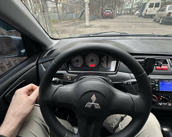 Серый Мицубиси Лансер, объемом двигателя 1.6 л и пробегом 238 тыс. км за 4400 $, фото 20 на Automoto.ua