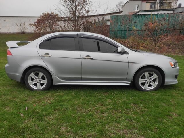 Серый Мицубиси Лансер, объемом двигателя 2 л и пробегом 124 тыс. км за 7499 $, фото 5 на Automoto.ua