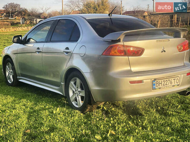 Серый Мицубиси Лансер, объемом двигателя 2 л и пробегом 226 тыс. км за 6200 $, фото 5 на Automoto.ua