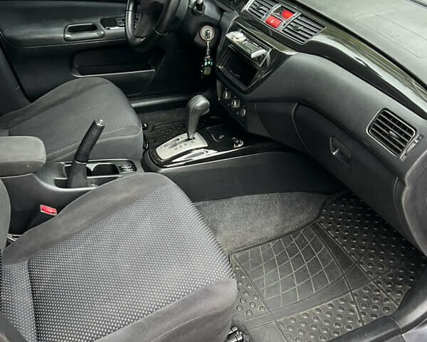 Сірий Міцубісі Lancer, об'ємом двигуна 1.58 л та пробігом 176 тис. км за 4700 $, фото 12 на Automoto.ua