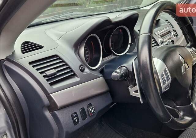 Серый Мицубиси Лансер, объемом двигателя 2 л и пробегом 213 тыс. км за 6550 $, фото 12 на Automoto.ua