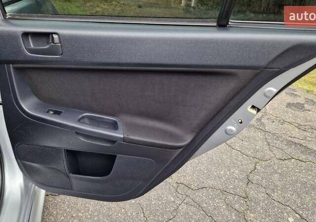 Серый Мицубиси Лансер, объемом двигателя 2 л и пробегом 213 тыс. км за 6550 $, фото 19 на Automoto.ua