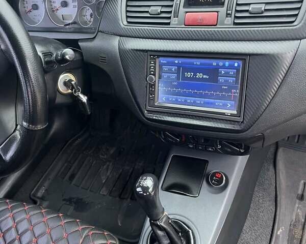 Сірий Міцубісі Lancer, об'ємом двигуна 1.58 л та пробігом 341 тис. км за 4500 $, фото 5 на Automoto.ua
