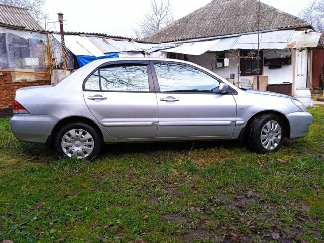 Сірий Міцубісі Lancer, об'ємом двигуна 1 л та пробігом 400 тис. км за 2850 $, фото 3 на Automoto.ua