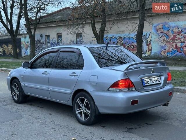 Серый Мицубиси Лансер, объемом двигателя 1.6 л и пробегом 210 тыс. км за 4600 $, фото 4 на Automoto.ua
