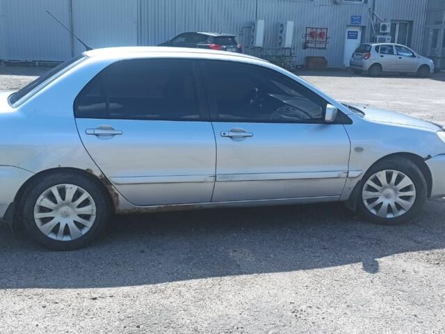 Сірий Міцубісі Lancer, об'ємом двигуна 1.6 л та пробігом 274 тис. км за 3200 $, фото 3 на Automoto.ua