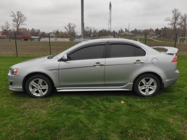 Серый Мицубиси Лансер, объемом двигателя 2 л и пробегом 124 тыс. км за 7499 $, фото 6 на Automoto.ua