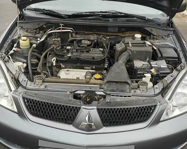 Серый Мицубиси Лансер, объемом двигателя 1.6 л и пробегом 181 тыс. км за 4500 $, фото 6 на Automoto.ua